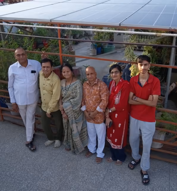 A happy family looking at their solar panel