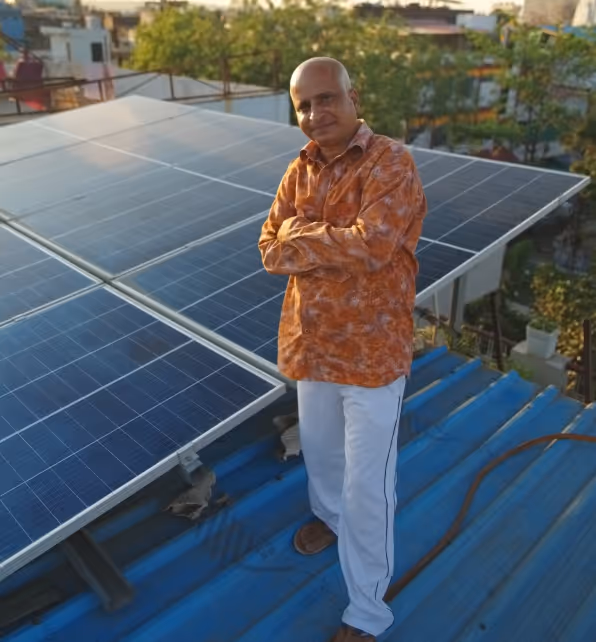 A happy family looking at their solar panel