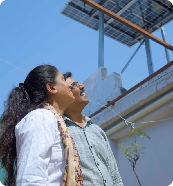 A happy family looking at their solar panel